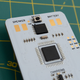 A close-up of the back of the Arduboy Mini showing the solder contacts for attaching a speaker and rechargeable battery.